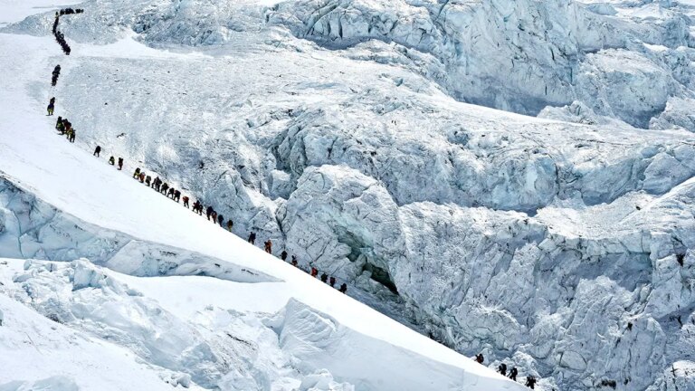 Unprecedented Surge: Record-Breaking Climbers Conquer Mount Everest Amid Overcrowding Warnings