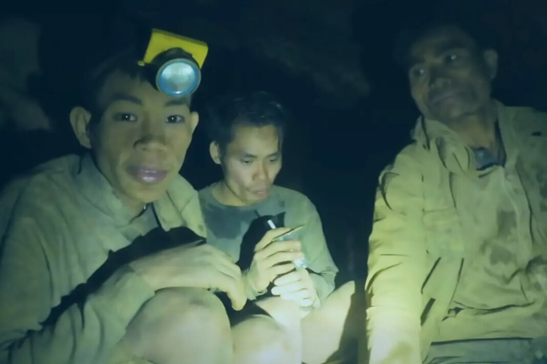 Rescuers work to drain flooded Laos cave to free 5 villagers and search for 2 still missing