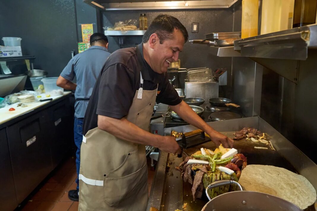 Mexican restaurant owner-chef Marco Mendoza prepares a hot molcajete, a traditional Mexican dish, at Cuernavaca