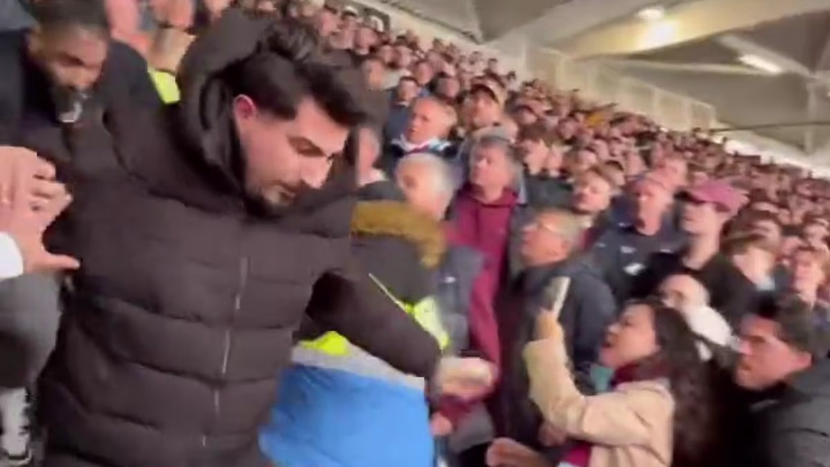 Shocking moment Arsenal fan is thrown down stadium steps after angering West Ham supporters by sitting in home end