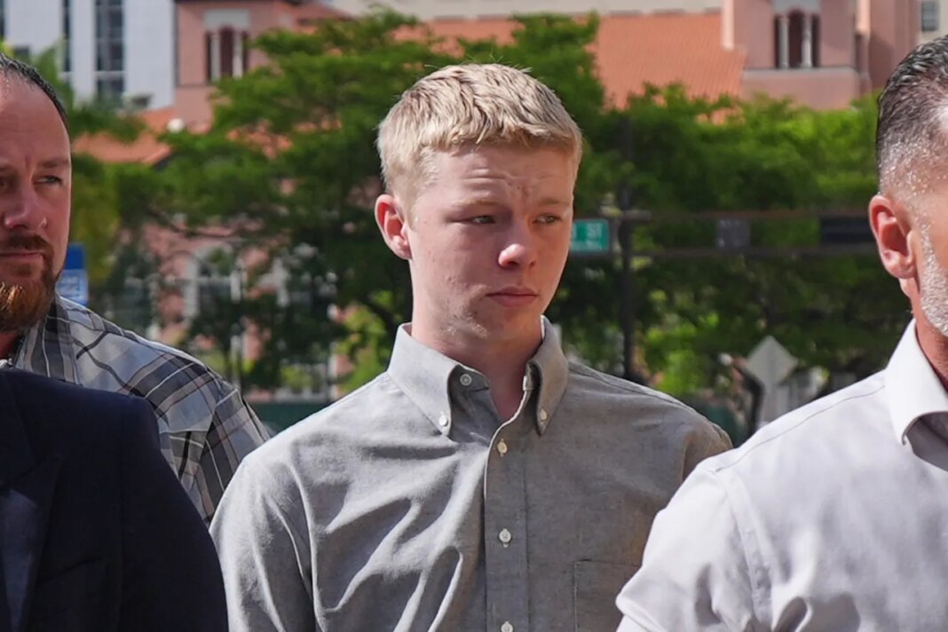 Timothy Hudson, center, charged with sexually assaulting and killing his 18-year-old stepsister on a Carnival Cruise ship, arrives for a hearing at the The James Lawrence King Federal Justice Building, Wednesday, May 27, 2026, in Miami. (AP Photo/Rebecca Blackwell)