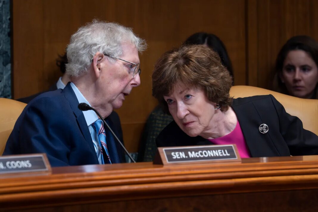 Sen. Mitch McConnell, R-Ky., chair of the Senate Defense Appropriations Subcommittee, left, confers with Sen. Susan Collins, R-Maine, chair of the Senate Appropriations Committee, as they hear President Donald Trump