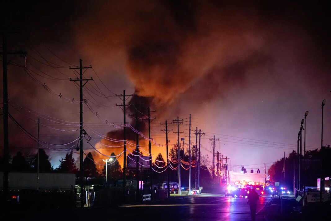 FILE - Plumes of smoke rise from the area of a UPS cargo plane crash at Louisville Muhammad Ali International Airport, Nov. 4, 2025, in Louisville, Ky. (AP Photo/Jon Cherry, File)
