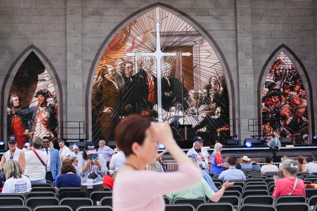 A person prays during Rededicate 250, a mostly conservative Christian prayer gathering in honor of the United States