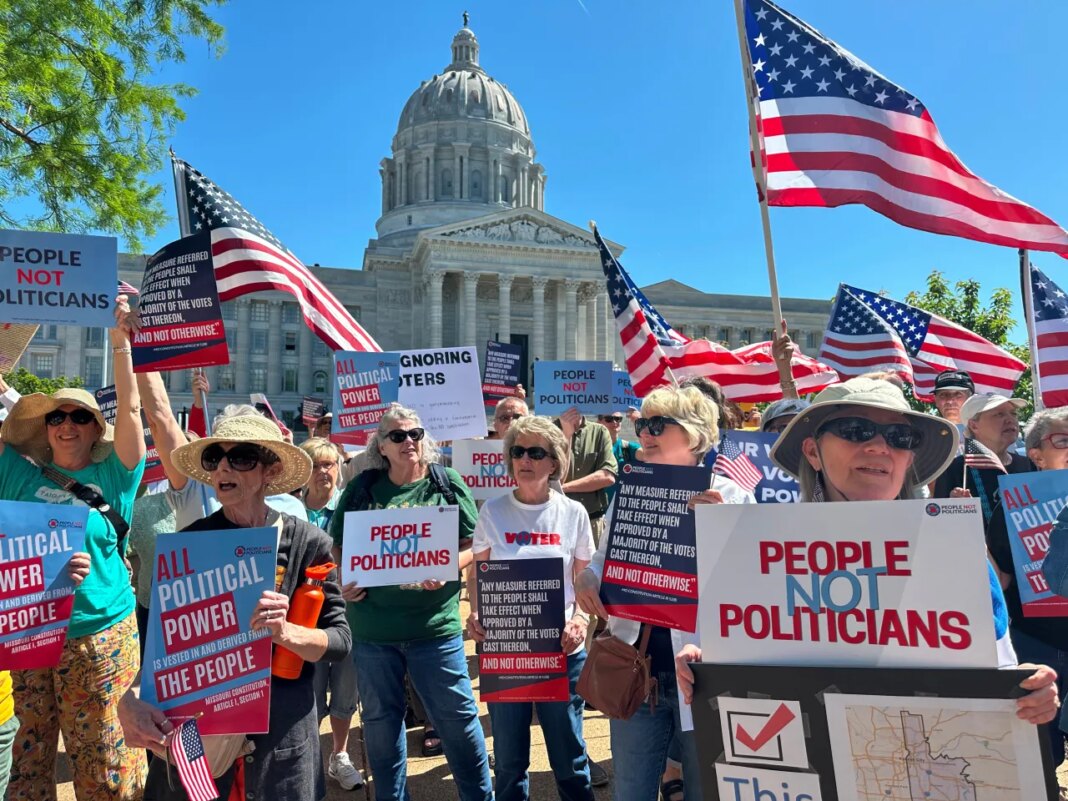 Protesters against a Missouri congressional redistricting plan gather outside the Missouri Capitol on Tuesday, May 12, 2026, in Jefferson City, Mo. (AP Photo/David A. Lieb)