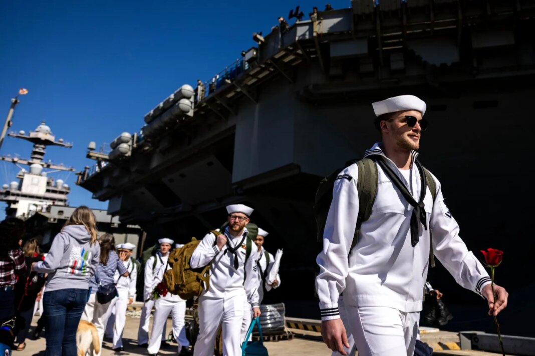 Sailors make their way to their loved ones after disembarking from the USS Gerald R. Ford at Naval Station Norfolk in Norfolk, Va. on Saturday, May 16, 2026, following an 11 month deployment. (Kendall Warner/The Virginian-Pilot via AP)