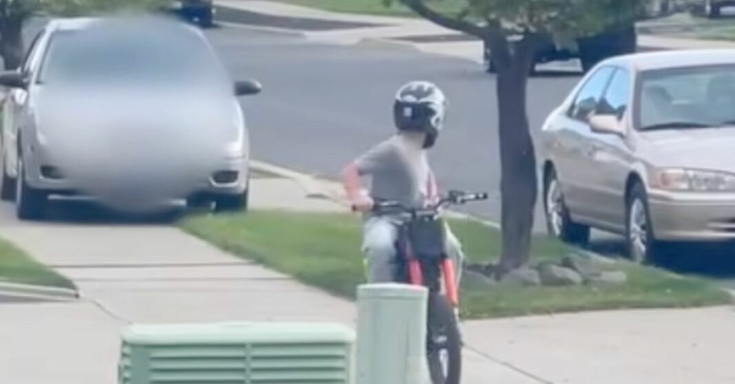 Woman speeds Ford on sidewalk after child on dirt bike: Cops