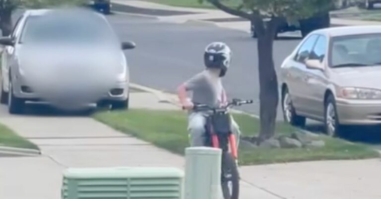 Shocking Sidewalk Showdown: Woman Drives Ford to Confront Child on Dirt Bike