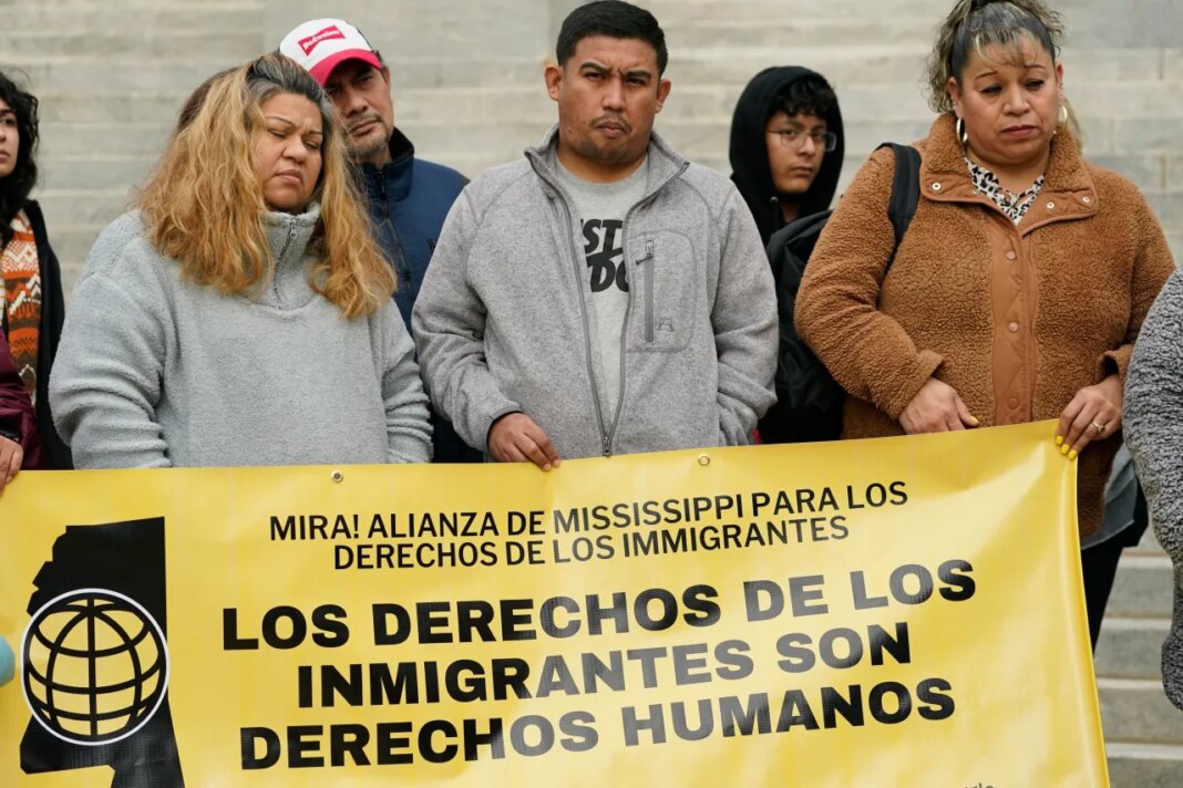 FILE - A group of immigrants attend a news conference held by the Mississippi Immigrants Rights Alliance regarding legislative proposals affecting immigrants and migrants in Mississippi, Wednesday, Jan. 25, 2023, at the Capitol in Jackson, Miss. (AP Photo/Rogelio V. Solis, File)