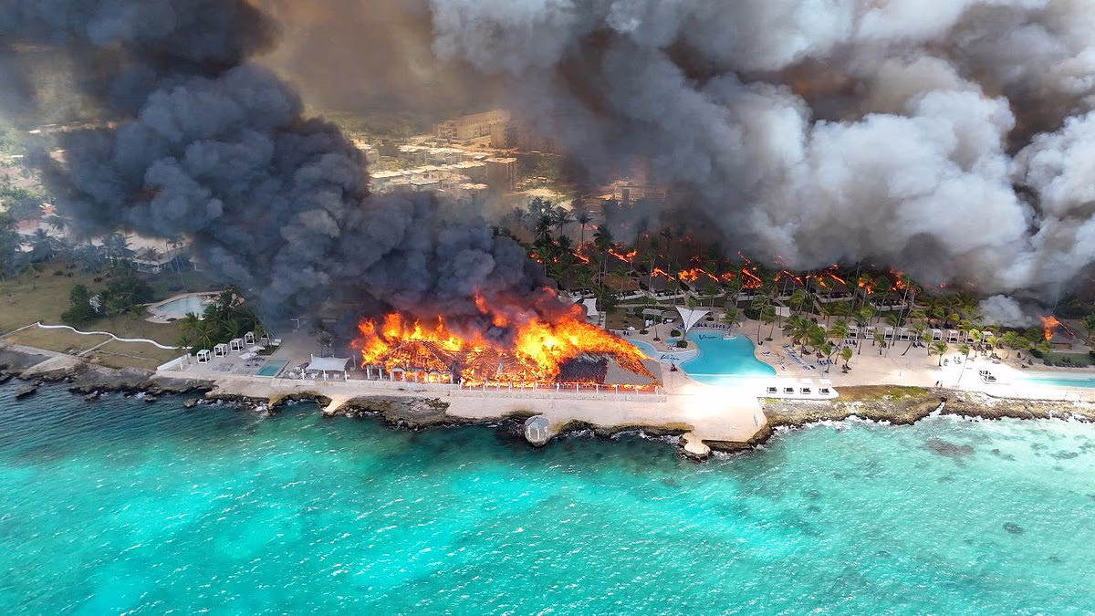 At least one dead and 1,700 evacuated after fire at beach resort