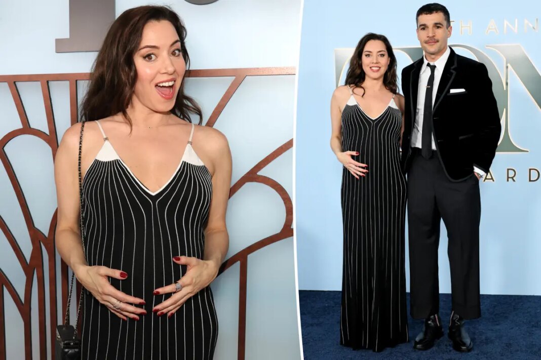 Aubrey Plaza cradles her baby bump while supporting partner Chris Abbott at Tony Awards 2026