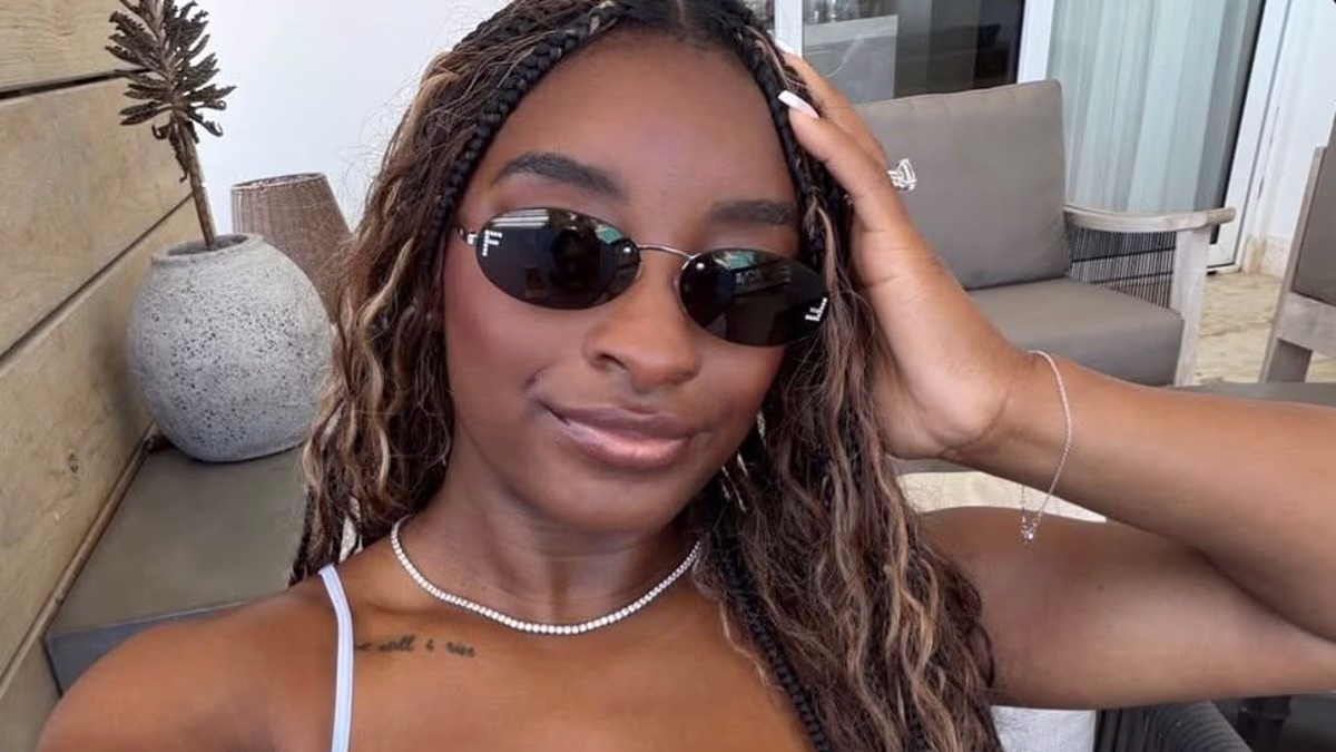 Biles gives health update from vacation after nearly dying in hospital