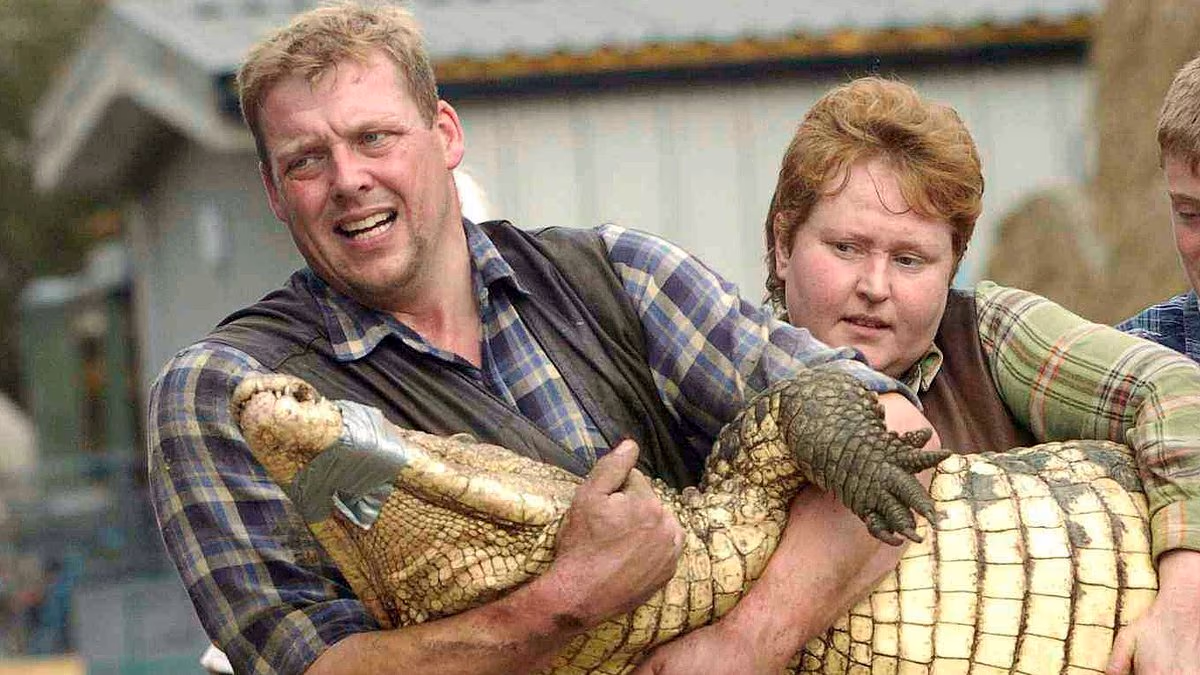 Bystanders in tears after child thrown into crocodile pit by stranger