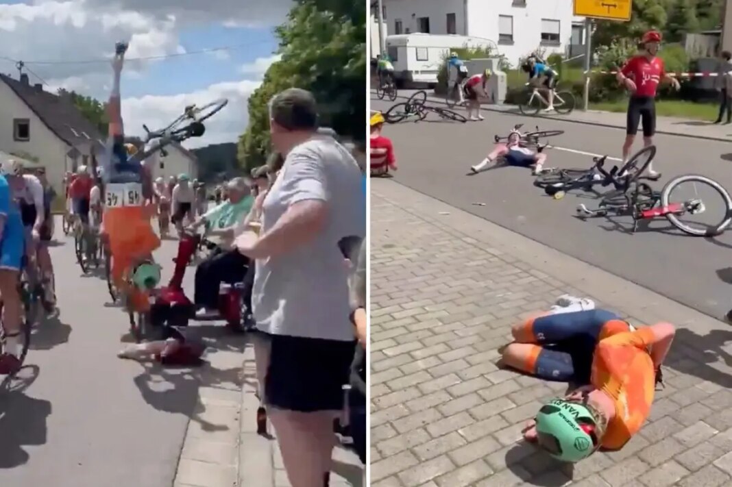 Cyclists crash, somersault off bikes as elderly woman on mobility scooter drives into race: video