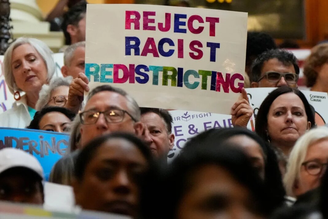 People demonstrate during a special legislative session at the state capitol, Wednesday, June 17, 2026, in Atlanta. (AP Photo/Mike Stewart)