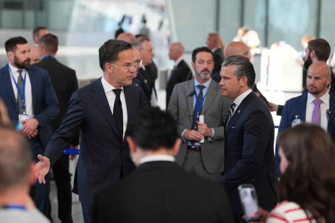 United States Defense Secretary Pete Hegseth, center right, and NATO Secretary General Mark Rutte, center left, arrive for a media conference during a meeting of NATO defense ministers at NATO headquarters in Brussels, Thursday, June 18, 2026. (AP Photo/Virginia Mayo)