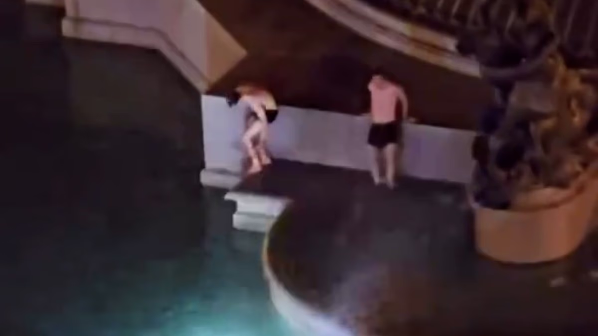 Two men climb into Rome's ancient Fountain of the Naiads before hotel guests spot them in intimate embrace and call cops