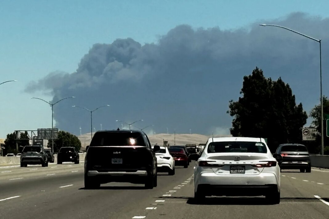 Smoke from a medical supply warehouse fire in Tracy, Calif., is seen from Livermore on Thursday, June 11, 2026. (Santiago Mejia/San Francisco Chronicle via AP)