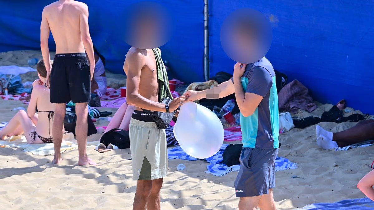 Youths inhale 'hippy crack' on Bournemouth beach as police make arrests - with 40C 'heat dome' looming over Britain