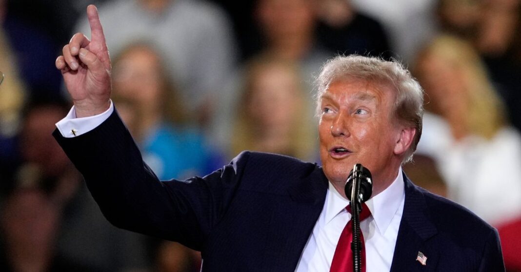 Donald Trump pointing in the air