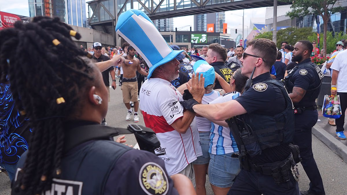 Aggro on the streets: Armed police arrest fans after Three Lions' loss