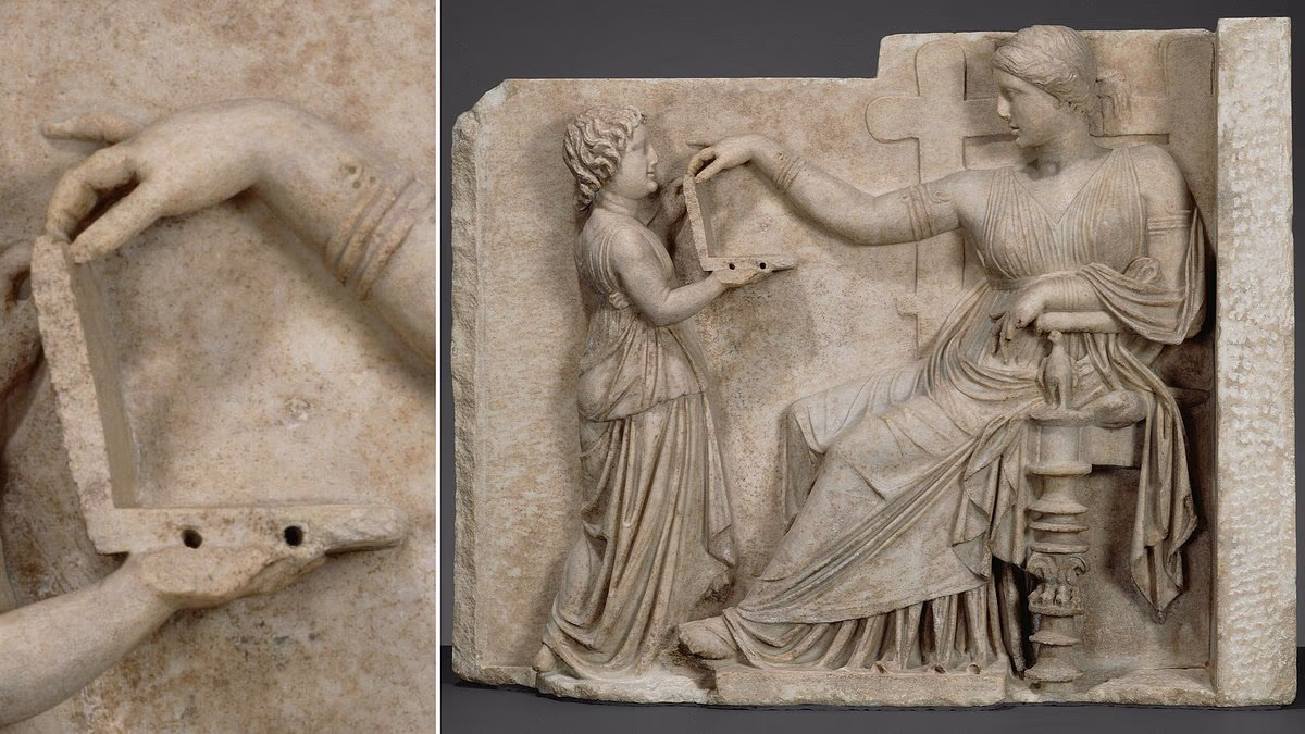 Ancient Greek statue holding a 'laptop' fuels time travel claims