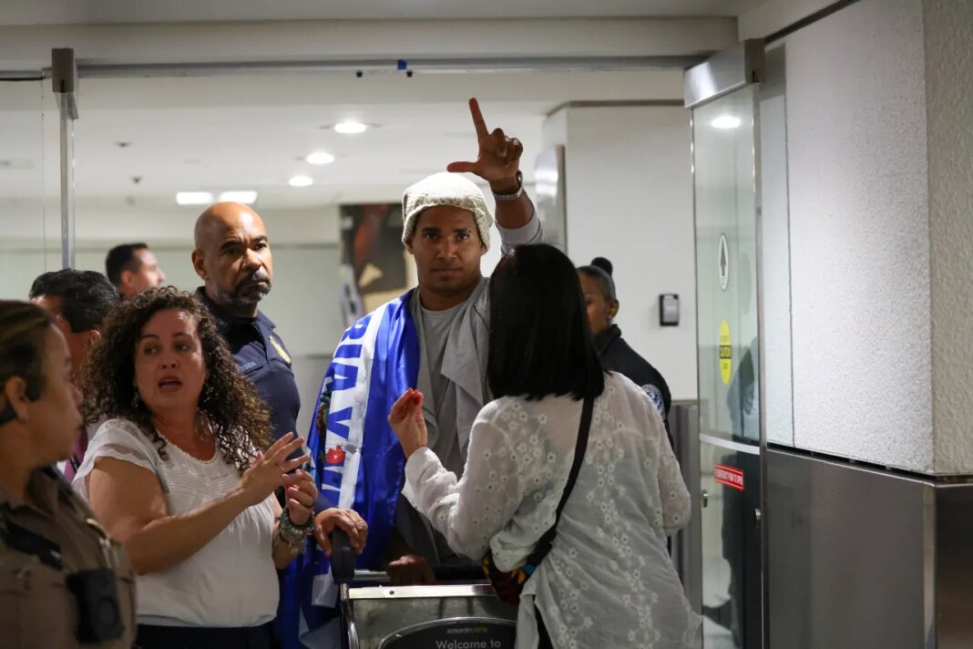 Cuban dissident artist Luis Manuel Otero Alcántara reacts after arriving at Miami International Airport on Saturday, July 18, 2026, after serving a five-year prison sentence in Cuba. (AP Photo/David Santiago)
