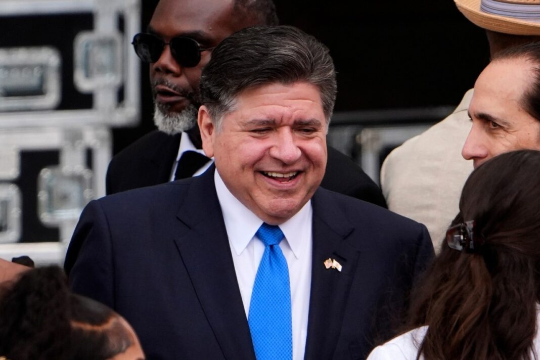 FILE - Illinois Gov. JB Pritzker, center, mingles ahead of the Obama Presidential Center dedication ceremony Thursday, June 18, 2026, in Chicago. (AP Photo/Jeff Roberson,File)