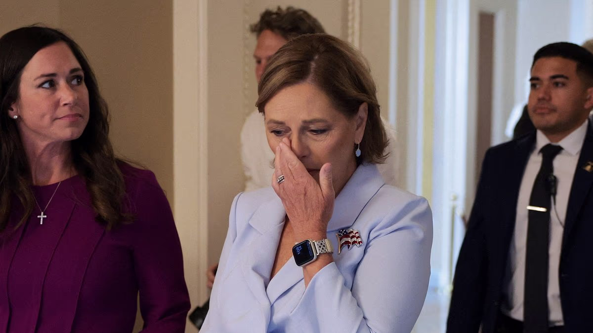 Graham's teary-eyed sister is sworn in to fill her brother's seat