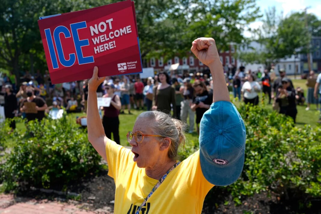 Protesters gather at a park near the scene of a shooting involving U.S. Immigration and Customs Enforcement, Monday, July 13, 2026 in Biddeford, Maine. (AP Photo/Robert F. Bukaty)