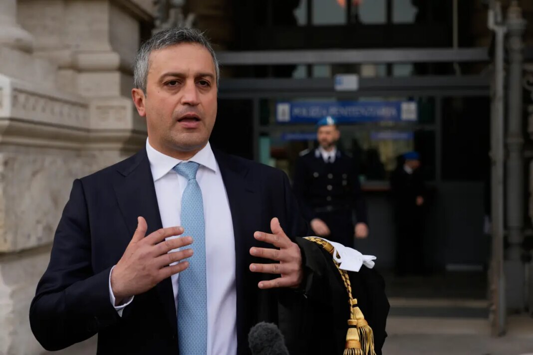 FILE - Lawyer Marco Mellone speaks during an interview outside Italy