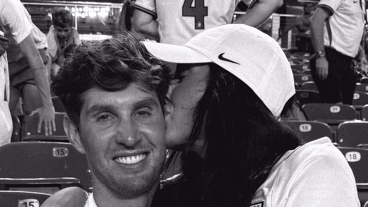 John Stones' wife Olivia gives him a congratulatory kiss