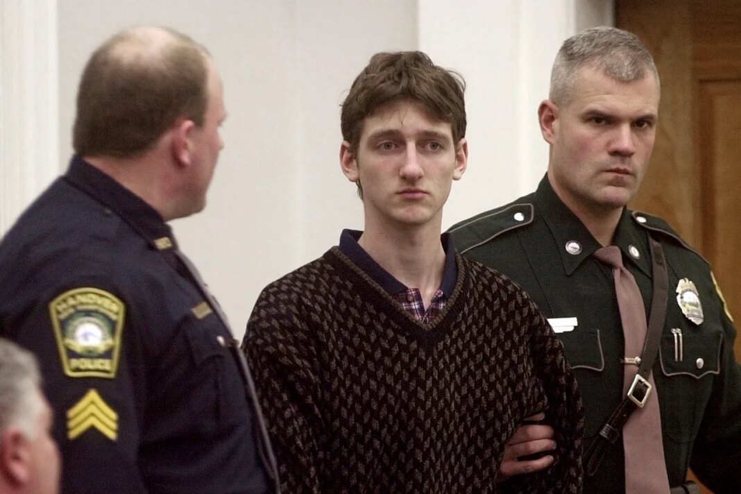 FILE - Robert Tulloch, 17, is escorted into Lebanon, N.H. District Court by Tropper James Stienmetz, right, and Hanover Sgt. Jeffrey Fleury, Feb. 21, 2001. (AP Photo/Jim Cole, File)