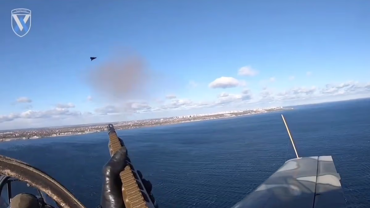 Moment Ukraine backseat gunner shoots Russian drone from open cockpit