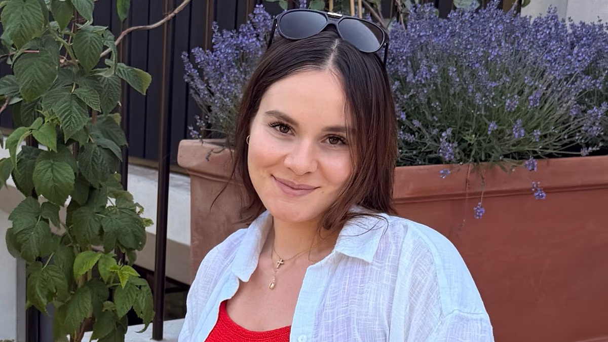 Pregnant Holly Ramsay cradles her growing baby bump in a red swimsuit as she enjoys the heatwave with husband Adam Peaty amid new family fallout
