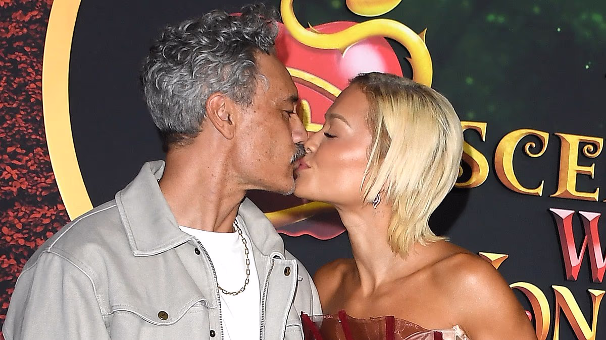Rita Ora packs on the PDA with husband Taika Waititi as she sizzles in a daring sheer fishtail gown at the premiere of Disney's Descendants: Wicked Wonderland