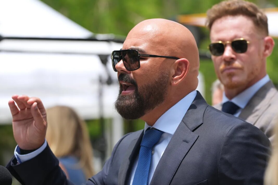 Attorney Joseph McBride, representing Andrew and Tristan Tate after they were arrested to face rape and sex trafficking charges against them in the United Kingdom, speaks with the news media outside of the C. Clyde Atkins U.S. Courthouse, Monday, July 20, 2026, in Miami. (AP Photo/Lynne Sladky)