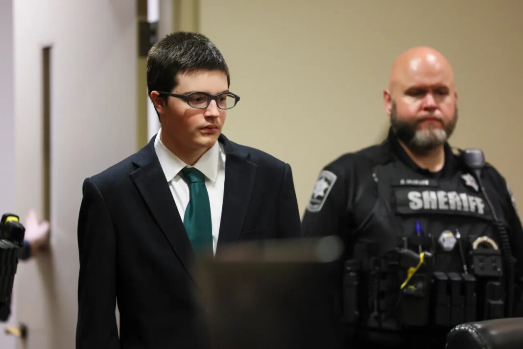 Colt Gray, the 16-year-old Apalachee High School shooting suspect, is led in by deputies for his sentencing at Barrow County Superior Court, Monday, July 27, 2026, in Winder, Ga. (Jason Getz/Atlanta Journal-Constitution via AP, Pool)