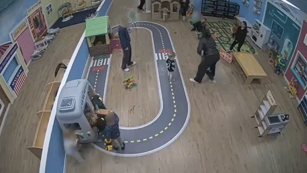 Staff member with toddler during incident