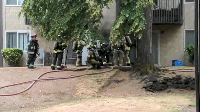 Animated video shows firefighters opening an electrical room door before an explosion sends flames and debris outward at a Tacoma apartment complex.