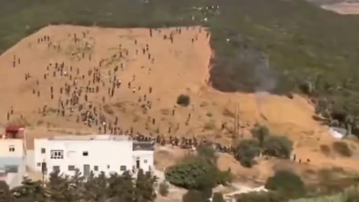 Moment hundreds of migrants try to storm Ceuta in 'invasion' attempt