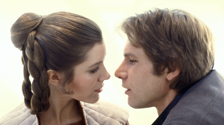 Han and Leia going in for a kiss in 