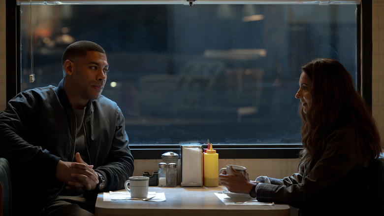 John Stewart and Zoe Macon sitting at a table on 