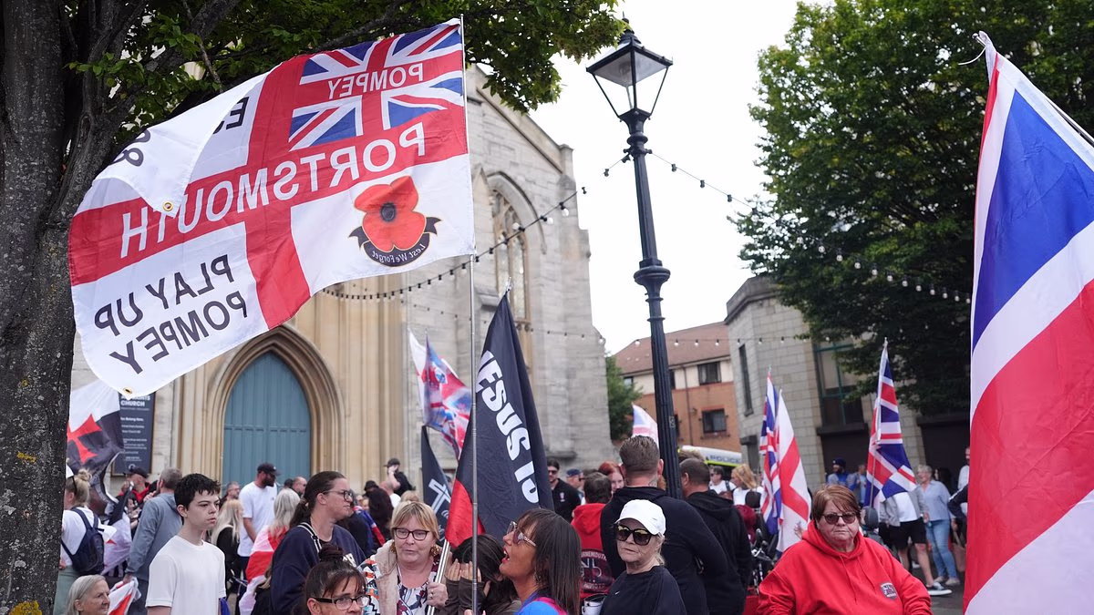 Anti-migrant protesters march in Portsmouth as police ban face covers