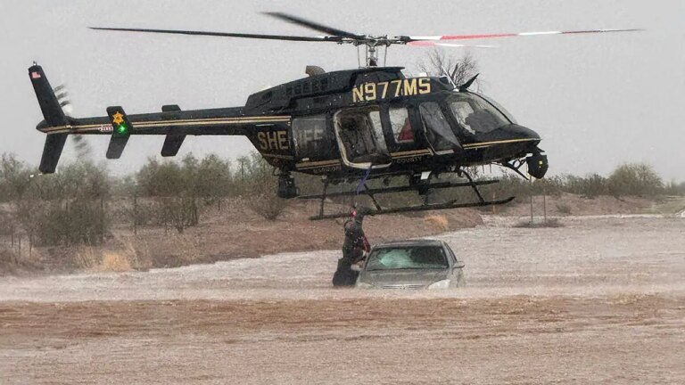 Arizona Sheriff Helicopter Rescues 2 From Flooded Car