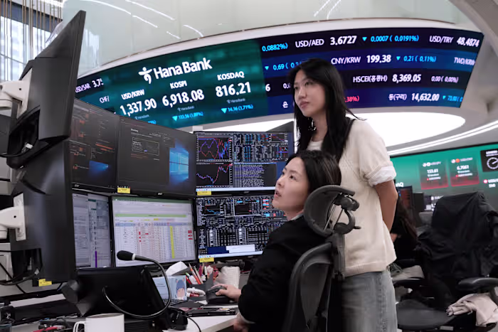Asian shares fall and oil prices hold steady above $100 a barrel