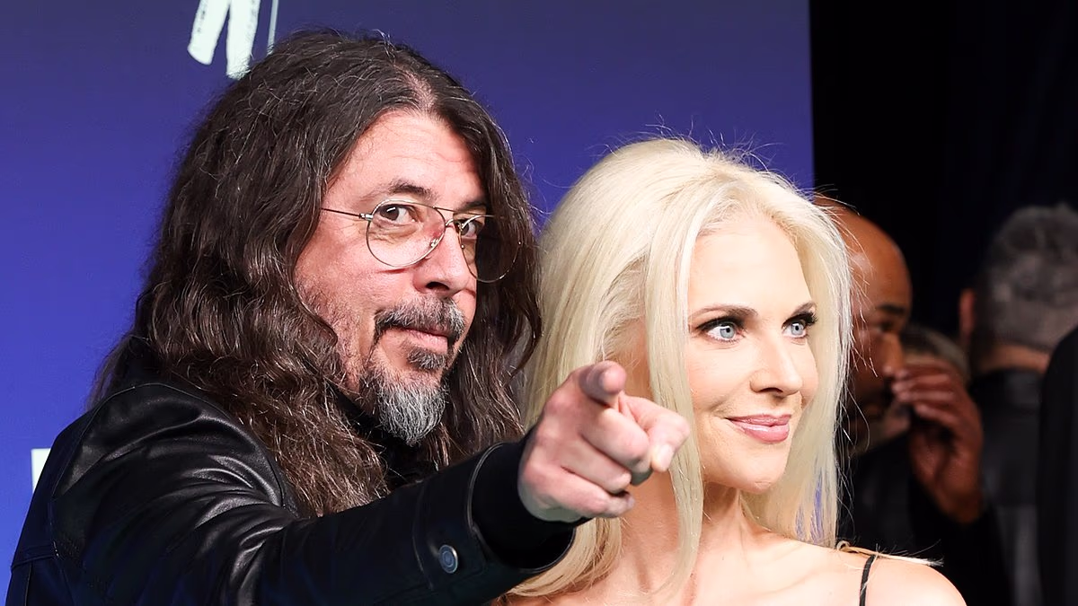 Dave Grohl slammed as he poses with wife Jordyn Blum at the VMAs