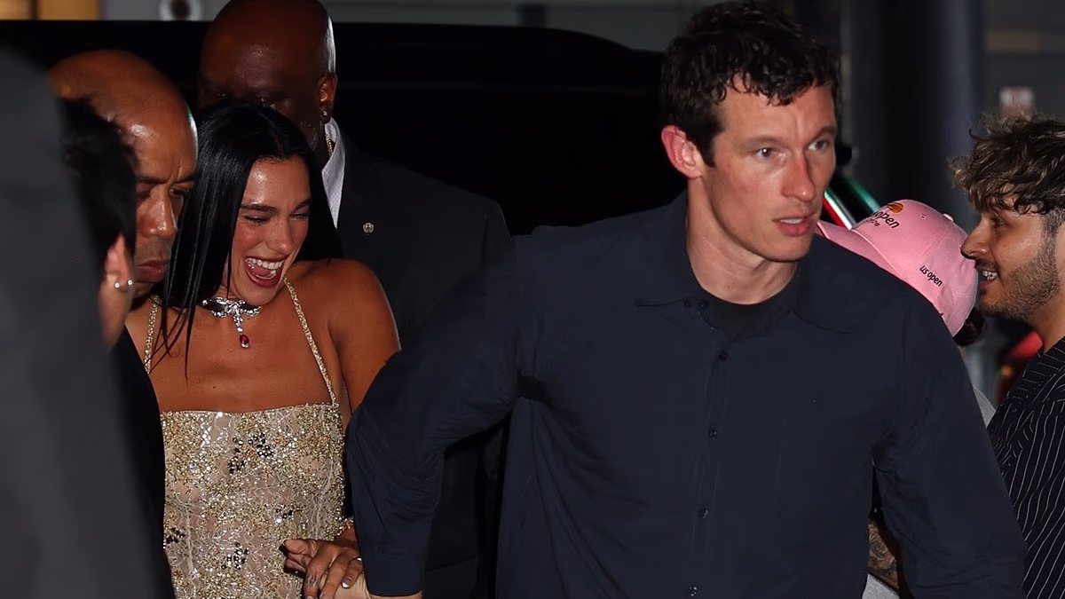 Dua Lipa and Callum Turner hold hands as they enjoy a date night