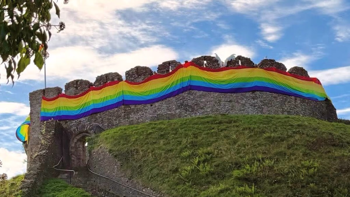 Fury as town's historic castle is draped in giant rainbow flag