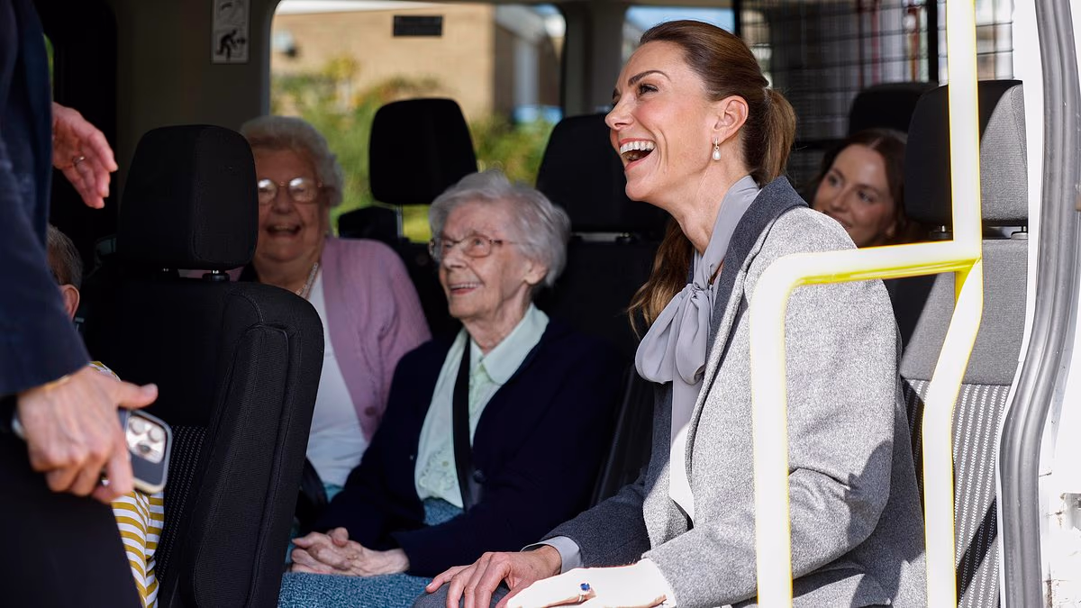 Giggling Kate delights elderly minibus passengers alongside volunteers